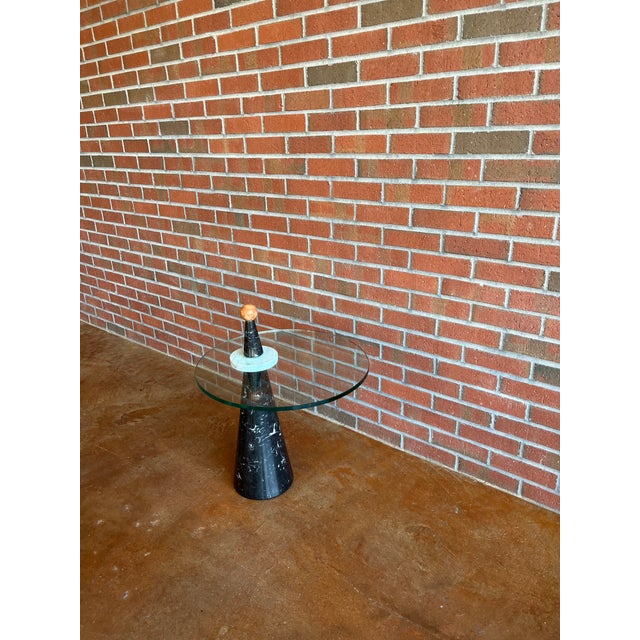 Striking Postmodern Tri-Color Marble Table with Round Glass Top, designed in the style of Ettore Sottsass for the Memphis...