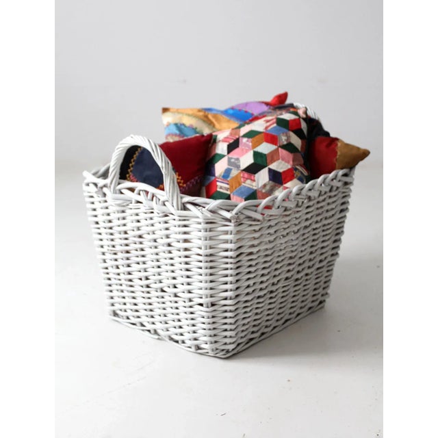 This is a vintage white storage basket. The large braided wood basket features double handles. Ideal for storing linens,...