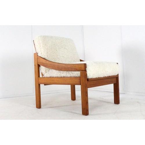 A freestanding designer armchair in a Scandinavian style. This pine chair, with its beautiful, trendy new Doodle Cream...