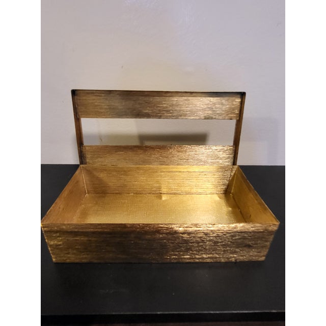This vintage 1970s brass tissue box showcases an intricately textured design, characteristic of Hollywood Regency style....