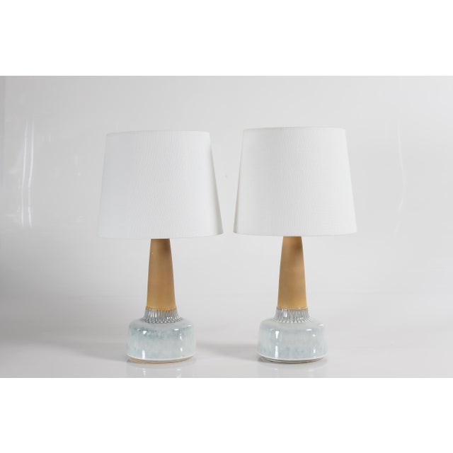 Pair of mid-century Danish table lamps by Danish ceramist Einar Johansen for Søholm. Made circa 1960's. The lamp base is...