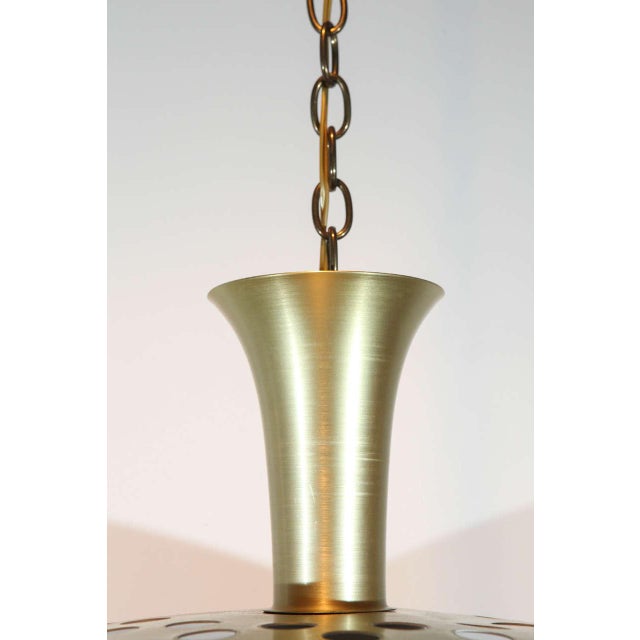 Spun aluminum fixture with anodized brass finish. Newly rewired for a single standard bulb. Ten available, priced...