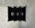 Postmodern magazine rack from Memphis based on a design by Ettore Sottsass from the 80s. Unfortunately there is no real...