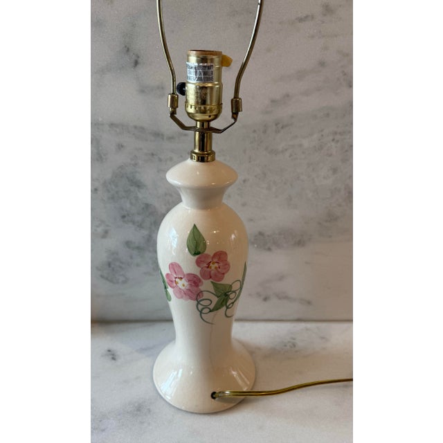 Vintage ceramic cream table lamp with hand painted pink and green floral design made by Cresswell. Lamp has dimmer switch...