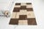 This is a vintage Turkish Oushak rug from the Mid 20th Century. The piece was hand-knotted.