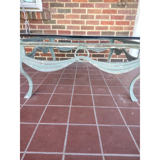 Add timeless charm to your outdoor living space with this beautiful vintage-style patio table featuring an ornate,...