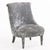Upholstered in soft silver-gray velvet, each chair features a gracefully curved high back with a rolled crest, gently...