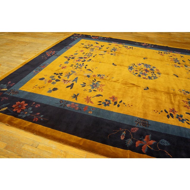 Antique Art Deco Chinese Floral, Medallion Blue Navy, Yellow 1920s Rug, Circa Date: 1920s. This exceptional example of...