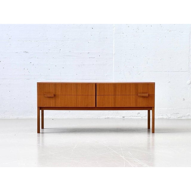 This elegant lowboard dates back to the heyday of danish furniture design in the 1960s and combines timeless aesthetics...