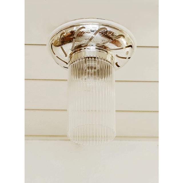 Art Nouveau ceiling lamp, manufactured 1915/20. Brass, openwork and decorated with floral engraving. Mounted on a renewed,...