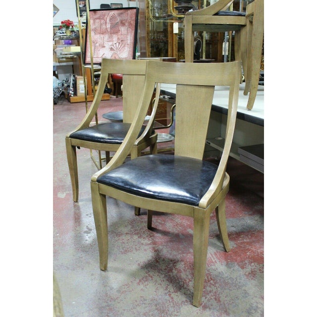 A beautiful set of 4 Mid Century Modern spoon back dining chairs. An unusual design reminiscent of designs by Edward...
