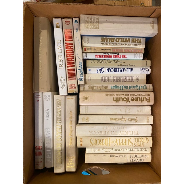 A set of 50 vintage books that range from colors of gray & white, author, year published that include a variety of...