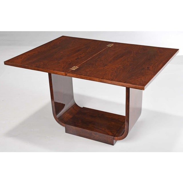 circa 1930, foldover swivel top, interior compartment, U shaped support, sloped plinth base, 7-1/4 x 31 x 21-1/4 in.