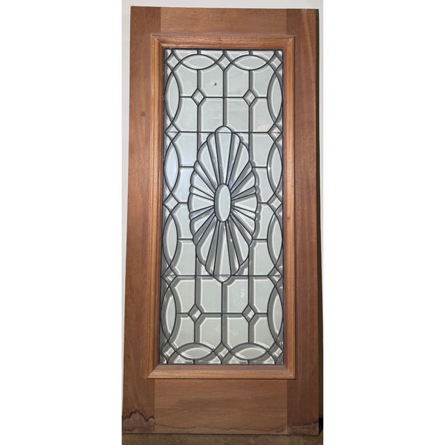 Mahogany "Antique" Leaded Glass Door - Oval Sunburst Leaded exterior/entry door made of Honduran Mahogany. Inquire into...