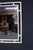 Hollywood Regency wall mirror featuring a faux bamboo frame in an ivory finish with a layered geometric design. The clean...