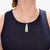 A fine vintage gold & jade pendant. In 14 karat yellow gold. With a prong-set carved jadeite drop with a double loop bail...