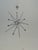 Brand new silver entryway/foyer chandelier from Scott Felder Homes. Never used or installed. Features a modern sputnik-...