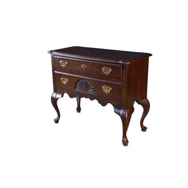 Vintage Queen Anne style lowboy chest, also referred to as a dressing table. Constructed from a rich, dark-toned solid...