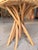 Contemporary coastal accent stool featuring a natural raffia seat paired with a sculptural solid teak base for an organic,...