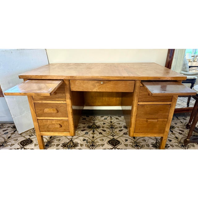Handsome and hard-working, this antique oak double-pedestal desk brings classic library character to any office, study, or...