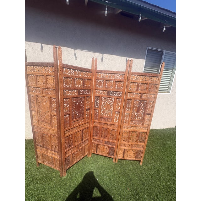 vintage, hand-carved wooden four-panel folding room divider screen with intricate floral and geometric fretwork 80 inches...