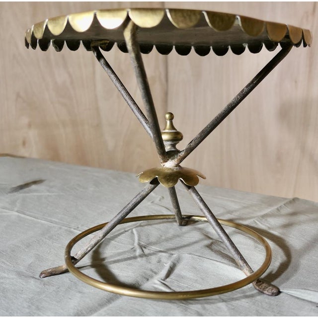An Attractive Brass and Iron Trivet A lovely piece, the round scalloped brass top is supported on 3 crossed iron legs with...
