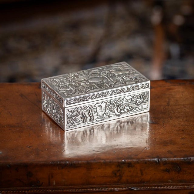 19th Century Chinese export silver box, of rectangular form, decorated in repousse' high relief, on very finely tooled...
