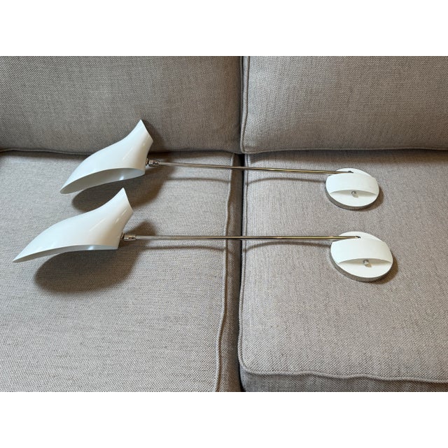 Design Plus Gallery presents a Pair of One Arm Sconces from David Weeks Studio. Each sconce has a single polished metal...