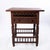 One drawer square table with cutouts and stretcher base. Beautiful carvings. Great for a side table.