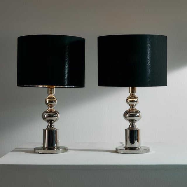 Chrome table lamp pair from the 1970s. The lamp has been given a new lampshade, with the inside of the lampshade in a...