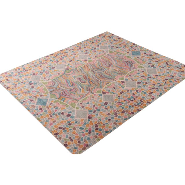 A modern 8x10 rug in prevailing blue colorway from the Homage Collection by Rug & Kilim. Hand knotted in wool, drawing...