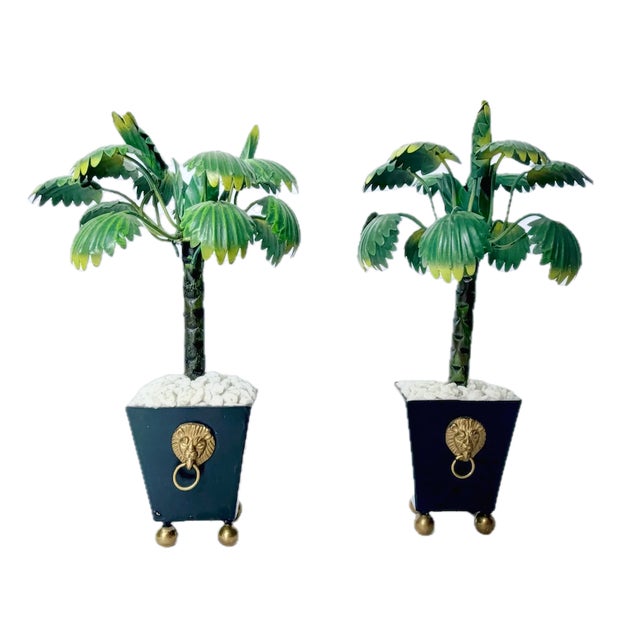 Vintage pair miniature tole palm tree sculptures with gravel tole pots decorated with brass lion face and ring handles....
