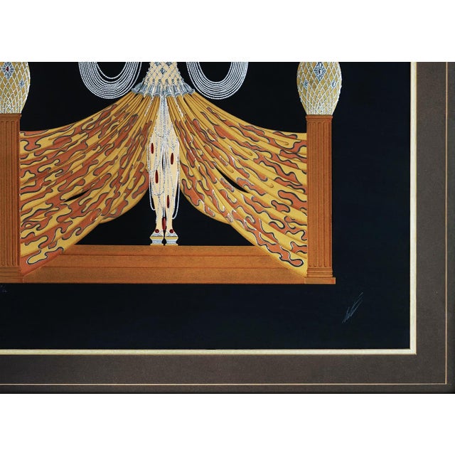 Serigraph in colors with foil stamping and embossment on wove paper. Hand signed lower right by Erte. Hand numbered...