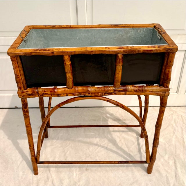 This vintage bamboo jardinière planter stand pairs beautifully crafted natural bamboo with a removable galvanized metal...