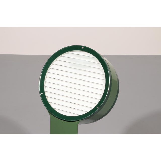 The Tamburo lamp, designed by Afra & Tobia Scarpa for Flos in 1973, is a timeless expression of Italian design innovation....