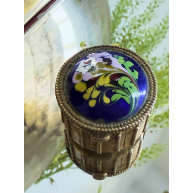 Vintage Estée Lauder Palazzo solid perfume compact featuring a domed cobalt blue enamel lid accented with a colorful...