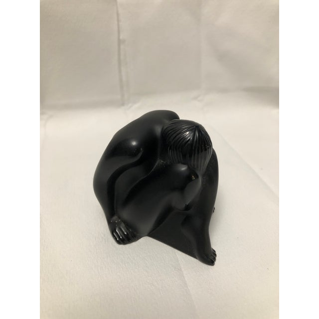 Bought new by me. No damage. Part of a series of reclining ladies in black crystal by Lalique.
