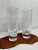 A pair of blown crystal vases designed by Vera Wang for Wedgewood. Tapered form with beveled edges and frosted dots around...
