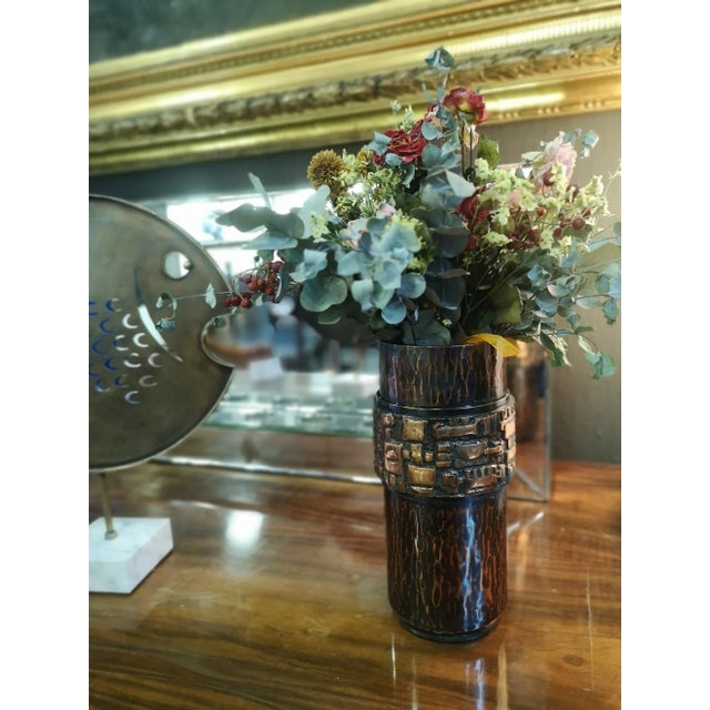A signed artisan piece, this brutalist handmade bronze and hammered copper vase was made in the 1970s, by artist Ildiko...