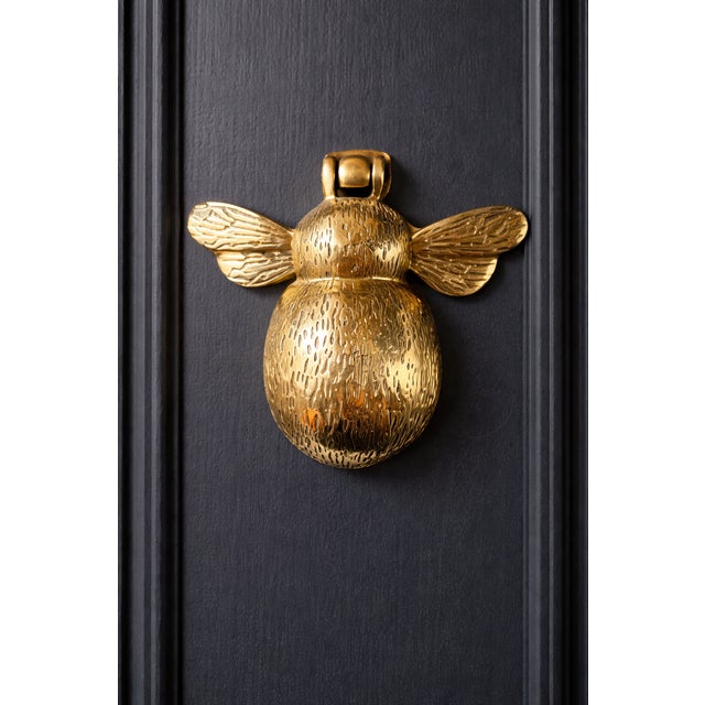 Purchased in England. Solid brass bumble bee door knocker.