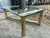 Karl Springer Hollywood Regency Style MCM Brass Tubular Coffee Glass Table is a vintage piece with a touch of glamour....
