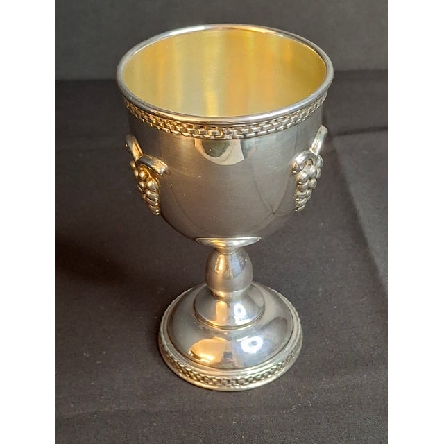 This vintage Israeli sterling silver Kiddush cup goblet (becher) features traditional Jewish ritual motifs. Hand-finished...