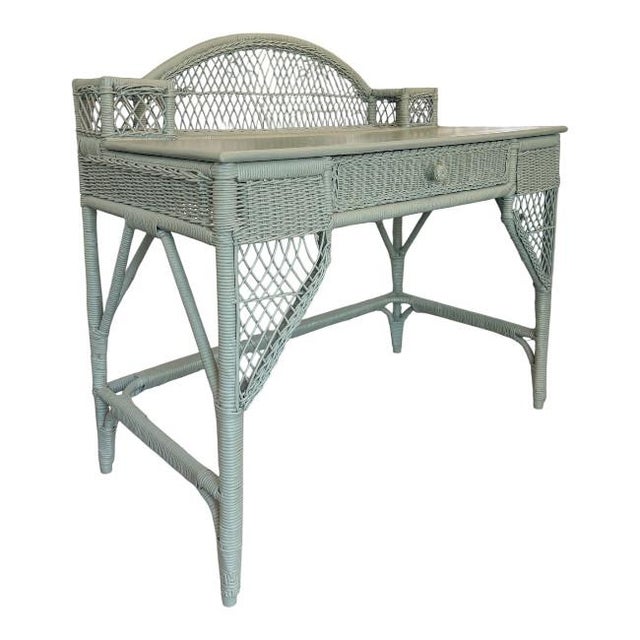 Bring timeless coastal charm to your home with this beautifully crafted vintage wicker writing desk. Featuring a...