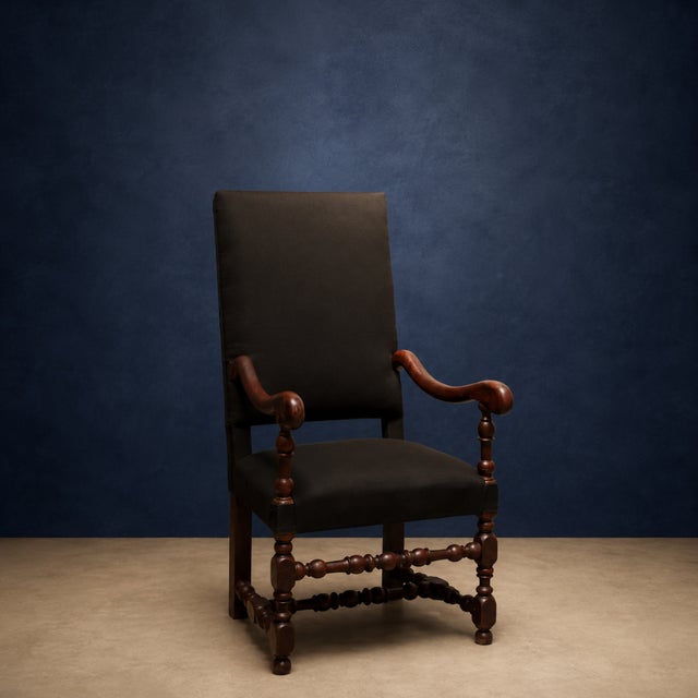 Add timeless French character to your space with this 19th century French Louis XIII walnut armchair, a beautifully...