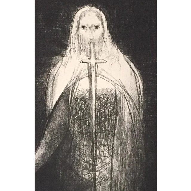 ''Et is avait en sa main droite sept étoiles'' is an original black and white lithograph realized by Odilon Redon in 1899....