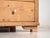 This antique solid pine chest of drawers embodies early 20th century rural European furniture, designed for everyday use...