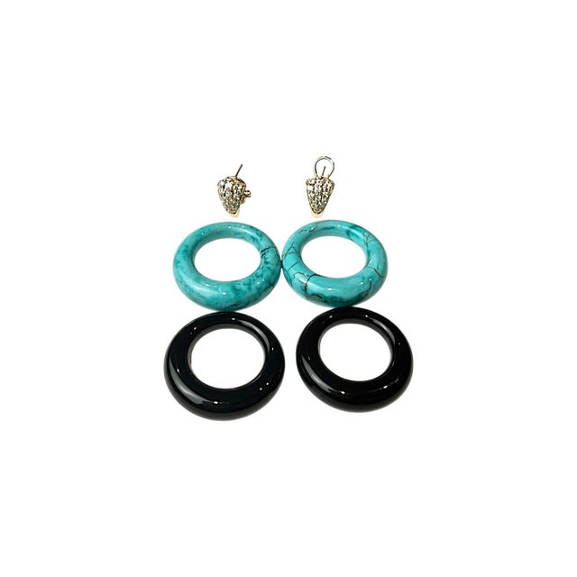 Bold, sculptural, and unmistakably chic, these 14K yellow gold door knocker earrings showcase a striking interplay of...