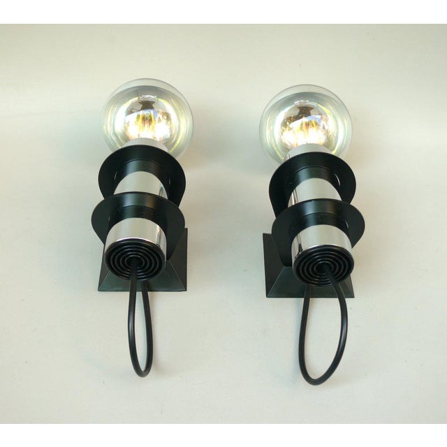 A pair of rare wall lights by Targetti Sankey, Italy, made in the 70s, Space Age era. Both lights have the original...