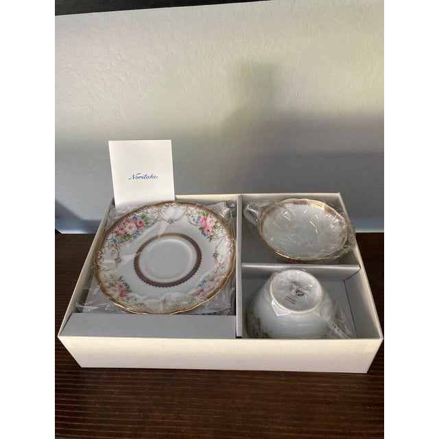 This elegant Noritake fine china tea set includes two cups and matching saucers, presented in its original box and...