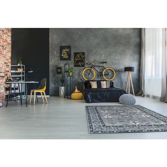 Maya Oushak Silver Hand Knotted Wool Rug, Country of Origin: India. This exquisite piece revives the grand scale and...